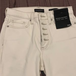 White button fly skinny jeans